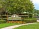 Attractive community sign for Mallard Pointe Park, surrounded by colorful flowers and lush greenery at 2547 Raccoon Run Ln, Orlando, FL 32837