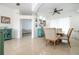Bright dining room with decorative furnishings adjacent to the living area at 2547 Raccoon Run Ln, Orlando, FL 32837