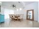 Elegant dining room features a large wooden table with seating for eight, complemented by a decorative mirror at 2547 Raccoon Run Ln, Orlando, FL 32837