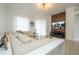 Bright living room with modern decor, comfortable seating, and a wall-mounted TV at 2547 Raccoon Run Ln, Orlando, FL 32837
