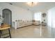 Spacious living room featuring tile floors, modern lighting, and an open layout at 2547 Raccoon Run Ln, Orlando, FL 32837