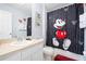 bathroom with a Mickey Mouse shower curtain and neutral walls at 2550 Renshaw St, Kissimmee, FL 34747