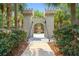Whimsical castle entrance amidst lush foliage, leading to an enchanting experience at 2550 Renshaw St, Kissimmee, FL 34747