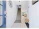 Welcoming entryway featuring a staircase and tile flooring, leading into the kitchen and living areas at 2550 Renshaw St, Kissimmee, FL 34747