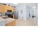 Kitchen area featuring wood cabinets, stainless appliances, and tiled flooring at 2550 Renshaw St, Kissimmee, FL 34747