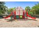 Castle-themed playground with slides and climbing structures for enjoyment at 2550 Renshaw St, Kissimmee, FL 34747
