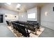 A luxurious home theater room featuring comfortable seating and a large screen at 2550 Renshaw St, Kissimmee, FL 34747