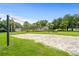 A sand volleyball court set in a grassy area for outdoor fun at 2550 Renshaw St, Kissimmee, FL 34747
