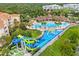 Aerial view of a waterpark with pools, slides, and nearby community amenities at 2550 Renshaw St, Kissimmee, FL 34747