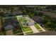 Aerial view showcasing a well maintained single-Gathering home with manicured landscaping and a two car driveway at 2663 Youngford St, Orlando, FL 32824