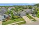 Aerial view of a charming single-Gathering home with a well-manicured lawn and mature landscaping at 2663 Youngford St, Orlando, FL 32824