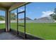 Enjoy outdoor living on this screened lanai with a view of the backyard at 2663 Youngford St, Orlando, FL 32824