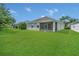 Enjoy outdoor living on this screened lanai with a view of the lush backyard at 2663 Youngford St, Orlando, FL 32824