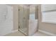 Bathroom boasting frameless glass shower with modern tile work and bright natural light at 2663 Youngford St, Orlando, FL 32824