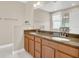 Bathroom featuring double sink vanity with granite countertop and modern fixtures at 2663 Youngford St, Orlando, FL 32824
