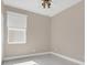 Bedroom with light walls, modern ceiling fan, and a window that allows for natural light at 2663 Youngford St, Orlando, FL 32824