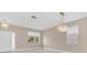 Bright living room with tiled flooring, contemporary light fixtures, and lots of natural light at 2663 Youngford St, Orlando, FL 32824
