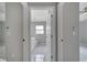 Bathroom featuring tile flooring, neutral paint, window, and doorway access to rooms at 2810 Maguire Dr, Kissimmee, FL 34741