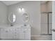 Bathroom features double sinks, mirrors and a shower with glass doors at 2810 Maguire Dr, Kissimmee, FL 34741