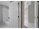 Bright bathroom featuring a clean white bathtub and tile flooring at 2810 Maguire Dr, Kissimmee, FL 34741