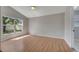 Bright bedroom with wood floors, ceiling fan, and natural light at 2810 Maguire Dr, Kissimmee, FL 34741