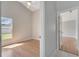 Bedroom has wood flooring, ceiling fan, and plenty of natural light at 2810 Maguire Dr, Kissimmee, FL 34741