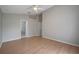 Bedroom with wood floors, ceiling fan and closet storage at 2810 Maguire Dr, Kissimmee, FL 34741