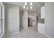 Open dining area with chandelier, flowing into the adjacent kitchen at 2810 Maguire Dr, Kissimmee, FL 34741