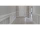 Inviting foyer featuring neutral paint, tile flooring, and decorative trim at 2810 Maguire Dr, Kissimmee, FL 34741