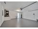 Large garage with overhead lighting, utility sink, and ample space for parking and storage at 2810 Maguire Dr, Kissimmee, FL 34741
