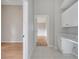 Hallway with tile flooring and a desk/cabinet area, providing a versatile space at 2810 Maguire Dr, Kissimmee, FL 34741