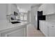 Modern kitchen with white cabinetry and stainless steel appliances at 2810 Maguire Dr, Kissimmee, FL 34741