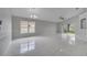 Open living room featuring tile flooring, ceiling fan, modern lighting, and access to the backyard at 2810 Maguire Dr, Kissimmee, FL 34741