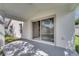 Covered patio with sliding glass doors that offer a seamless transition between indoor and outdoor living spaces at 2810 Maguire Dr, Kissimmee, FL 34741
