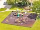 A modern, well-equipped playground featuring slides, climbing structures, and safety surfacing for play at 2810 Maguire Dr, Kissimmee, FL 34741