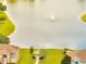 Scenic pond view with a fountain and a gazebo surrounded by green space at 2810 Maguire Dr, Kissimmee, FL 34741