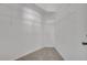 A walk-in closet with ample storage shelves and carpet flooring at 2810 Maguire Dr, Kissimmee, FL 34741