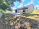 Manicured backyard includes a concrete patio, privacy fence, and green space at 283 Pine Arbor Dr, Orlando, FL 32825