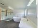 This modern bathroom features a soaking tub, glass shower, and updated vanity at 283 Pine Arbor Dr, Orlando, FL 32825