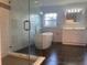 Spacious bathroom with a stand-alone tub, walk-in shower, and vanity at 283 Pine Arbor Dr, Orlando, FL 32825
