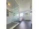 Elegant bathroom featuring a glass shower, soaking tub, and modern vanity at 283 Pine Arbor Dr, Orlando, FL 32825
