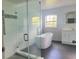 Modern bathroom featuring a glass shower, soaking tub, and vanity with drawers at 283 Pine Arbor Dr, Orlando, FL 32825