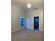 Bright bedroom featuring neutral walls and tile floors with ensuite bathroom at 283 Pine Arbor Dr, Orlando, FL 32825