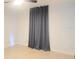 Bright bedroom with neutral walls, ceiling fan, and a blackout curtain at 283 Pine Arbor Dr, Orlando, FL 32825