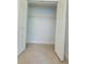 A walk-in closet with white wire shelving and white trim detail around the light-blue painted walls at 283 Pine Arbor Dr, Orlando, FL 32825