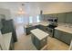 Spacious kitchen with stainless appliances, island and ample counter space at 283 Pine Arbor Dr, Orlando, FL 32825