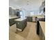 Contemporary kitchen with center island, stainless steel appliances, and tile flooring at 283 Pine Arbor Dr, Orlando, FL 32825