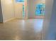 Bright living room featuring tile flooring, large windows and an entry door at 283 Pine Arbor Dr, Orlando, FL 32825