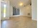 Bright living room with light tile flooring and ample natural light at 283 Pine Arbor Dr, Orlando, FL 32825