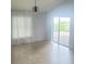Bright living room with light tile flooring featuring access to the backyard at 283 Pine Arbor Dr, Orlando, FL 32825